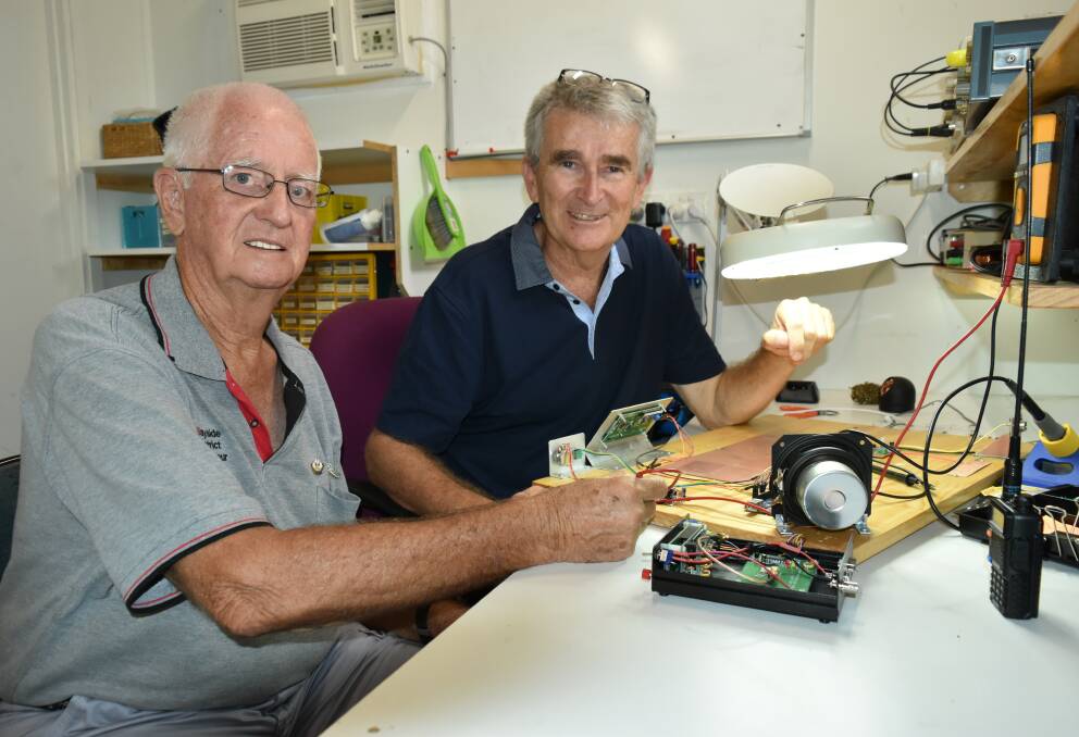 Bayside District Amateur Radio Society members Eddie Tomes and Phil Hutchings assemble radio gear. Photo: Hannah Baker