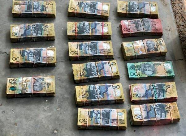 Police allegedly seized $149,000 cash and 25-kilograms of cannabis from an Alexandra Hills address last week. Photo: Queensland Police Service