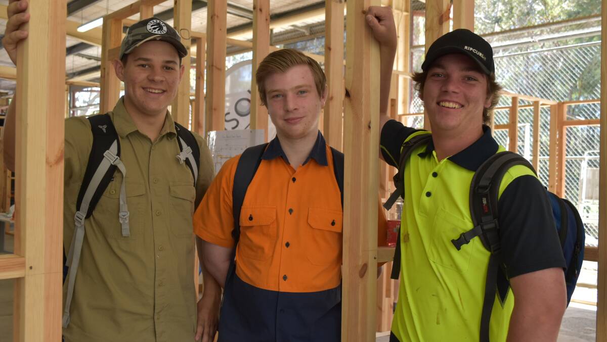Teens Noah, Jarrod and Corbin are studying construction certiciates. Noah said he liked working in a team, with Jarrod enjoying the fun at TAFE, Corbin said he liked working with his hands. Photo: Hannah Baker