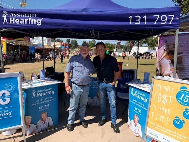 EASY LISTENING: Australian Hearing client Neil Haylock with Australian Hearing ambassador Troy Cassar-Daley at a recent pop-up hearing check location.