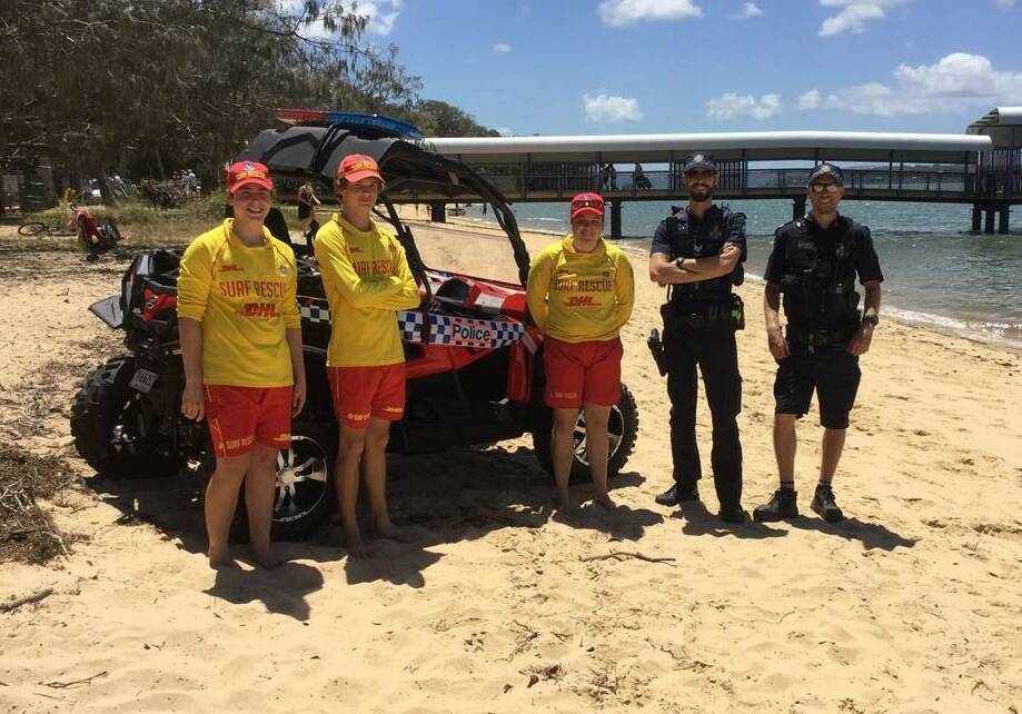 BEACH CRUISER: Coochiemudlo Island surf lifesavers with Senior Constable Ben Clinch and Senior Constable Dean Cox. Photo: Queensland Police Service