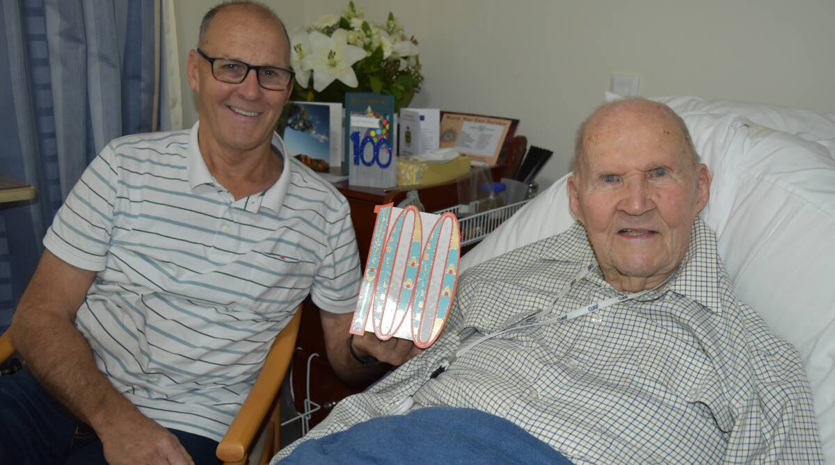 Rusty McWilliam, 100, said he attributed luck and his family's love to his longevity. He is pictured with son Ian McWilliam. Photo: Hannah Baker 