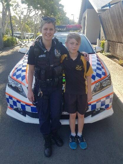 QUICK THINKER: Constable Jess Farlow with Noah, 12. Photo: Queensland Police Service
