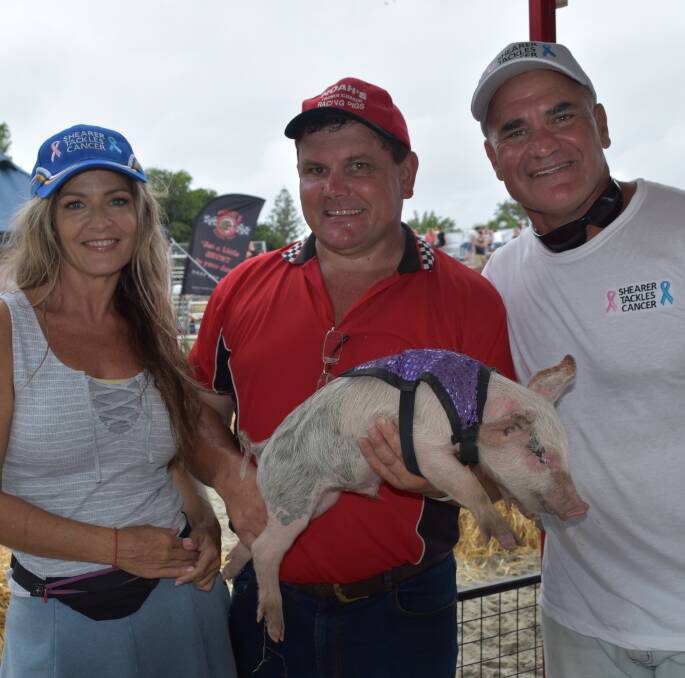 SQUEALING GREAT: Amanda Darker, Kevin Kiley, from Noah's Thoroughbred Racing Pigs, and Dale Shearer having fun at the piglet races. Photo: Hannah Baker