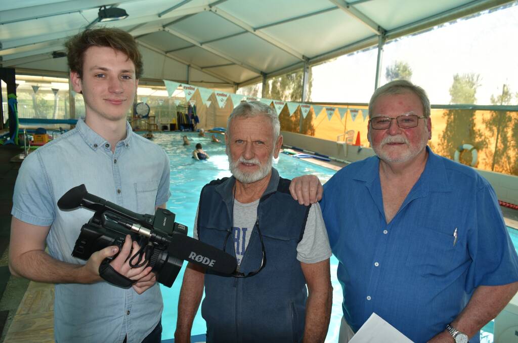 CREATIVE: Cameraman and film editor Daniel Helmstedt, 21, with Thornlands swim instructor Barry Eldridge and producer Wayne Cass, who is a former Cleveland District State High School film studies teacher. Photo: Hannah Baker