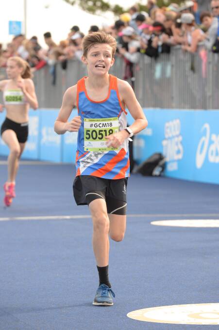 WINNER: Zane Pearce won the boys, aged 11 to 12 years, race at the Gold Coast marathon. Photo: Marathon-photos.com