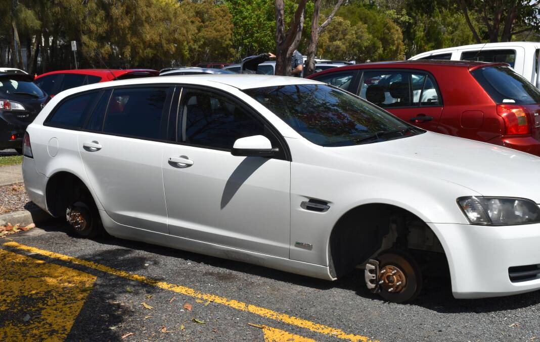 PROPERTY CRIME: This car was found by Redland City Bulletin missing all four wheels last Thursday at Toondah Harbour. Other cars have also been targeted.