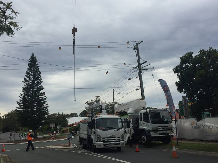 POWERLINES HIT: Workplace Health and Safety Queensland inspectors will need to visit the site before the crane can be moved away from powerlines.