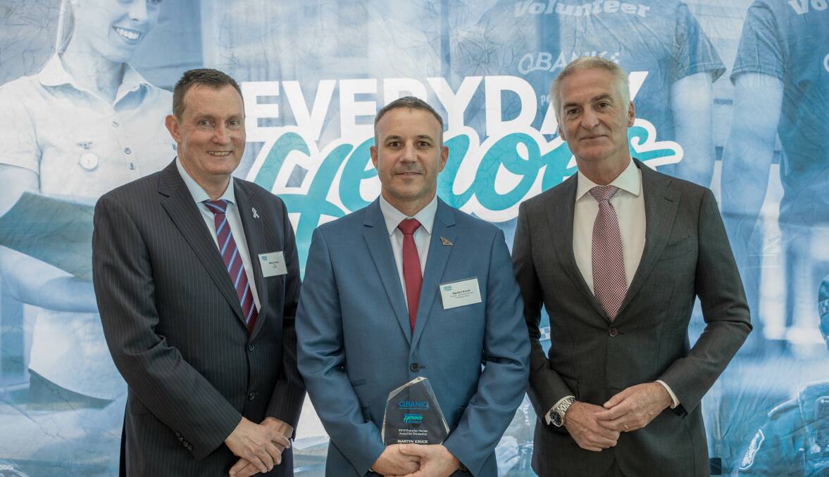 CHAMPION: QBANK chief executive Mike Currie with Redlands man Martyn Kruck and Andrew Lofthouse. Photo: Supplied