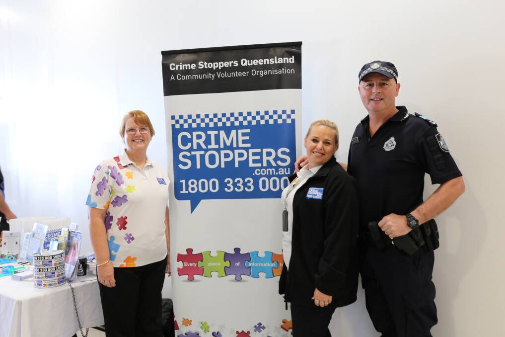 BOWLED OVER: Crime Stoppers members Janice Dorber and Corinne Tomasi with South Brisbane District Crime Prevention co-ordinator Acting Sergeant Brendon Winslow. Photo: Jocelyn Garcia
