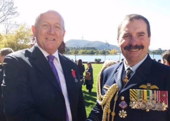Bravery medal recipient Kevin Hughes with Royal Australian Air Force air marshal Leo Davis. Photo: Supplied
