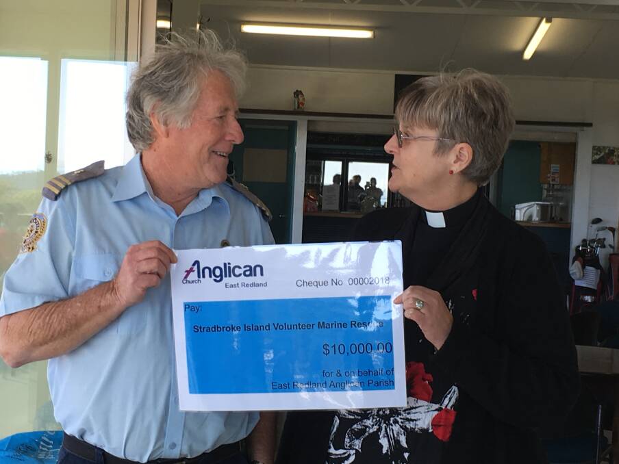 GREAT HELP: Doug Fraser receives the $10,000 cheque from Anglican Archdeacon for Moreton, The Vererable Denise Ferguson earlier this month. Photo: Supplied