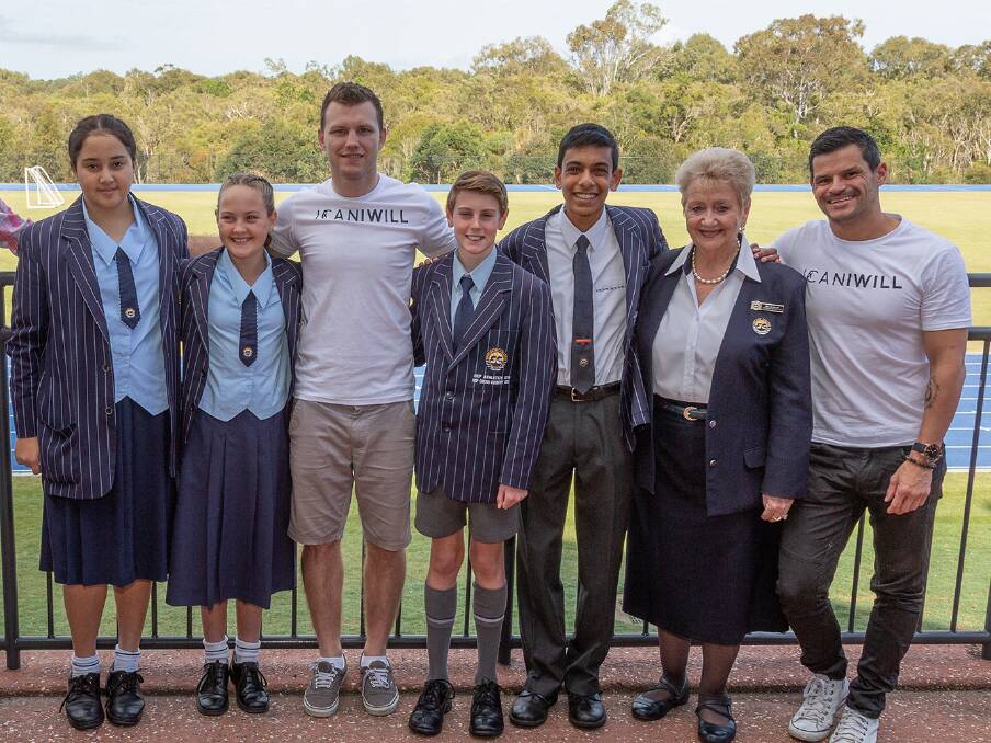 TOUGH: Year seven students Chloe Pudney and Olivia Wells with boxer Jeff Horn, year six student Luke Wills, year 11 student Brett Fernandes, principal Dr Lyn Bishop and ICANIWILL chief executive Conan Visser. Photo: Sheldon College