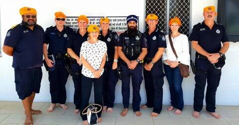 LATEST RECRUIT: Bayside Patrol Group officers joined Constable Singh at Brisbane Sikh Temple earlier this month to learn more about the Sikh religion. Constable Singh is pictured wearing the blue turban, which is part of his Queensland Police Service uniform. Photo: Queensland Police Service