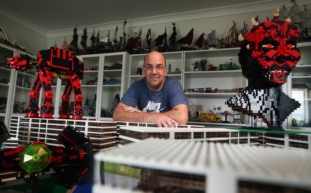 BIG TOYS: Graham Draper with Star Wars Lego favourites Darth Maul (right) and an AT-AT walker. Picture: Sylvia Liber.