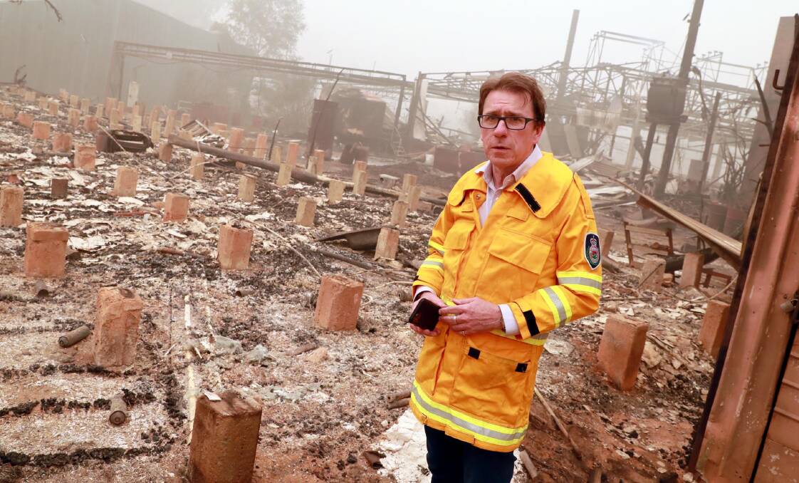 Member for Wagga Joe McGirr inspecting the damage caused by January's bushfires.