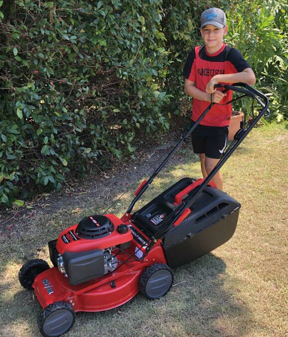MOWING: Weston Dalmaso mowed his way towards the purchase of a tinnie after saving bottles and cans htrough the Container Refund scheme.