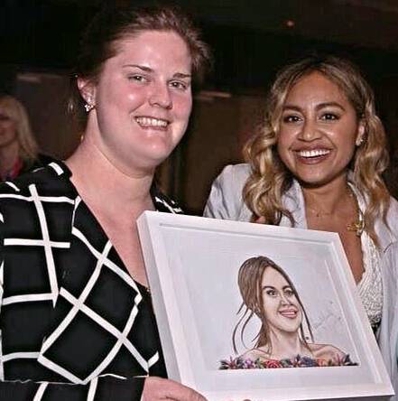 MAUBOY: Artist Rebekah McKaskill with Jessica Mauboy after drawing her portrait used in a fund raising auction.