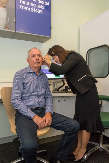 HEARING: Pete Bains gets his hearing checked by audiologist Kelli Noguchi,
 as Spec Savers first audio customer at Victoria Point.