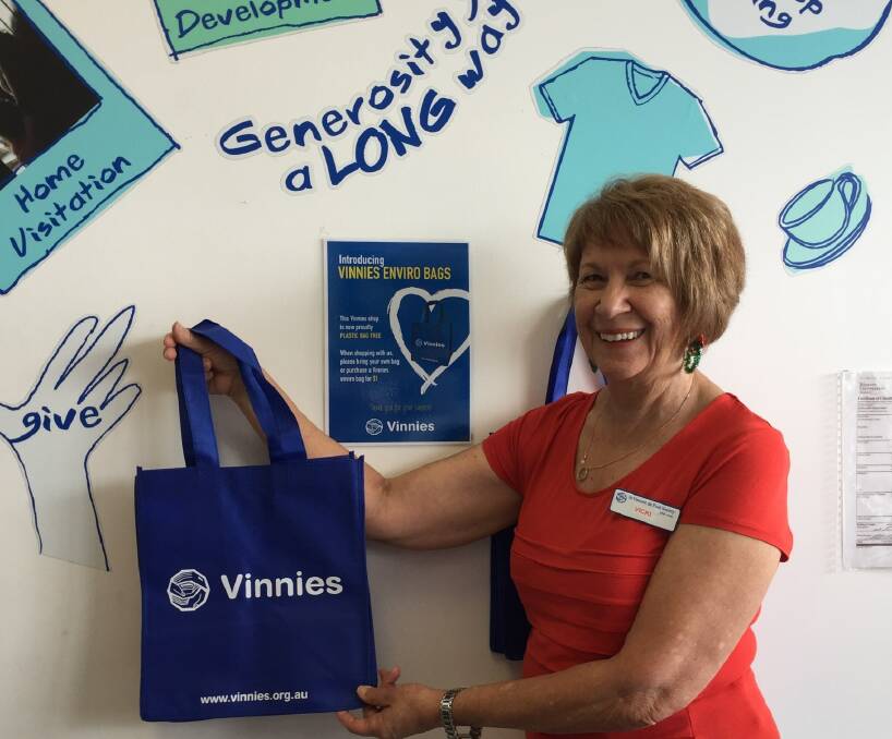 REUSABLE: Vicki Geraghty of Ormiston displays a Vinnies Queensland reusable bags.  It will be a case of buying a $1 reuseable bag or bringing your own when Vinnies introduces its eilmination of single-use plastic bags from December 31.