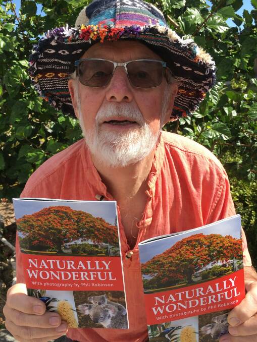 WILDLIFE: Wildlife photographer Phil Robinson with his book Naturally Wonderful, depicting local animals and creatures.