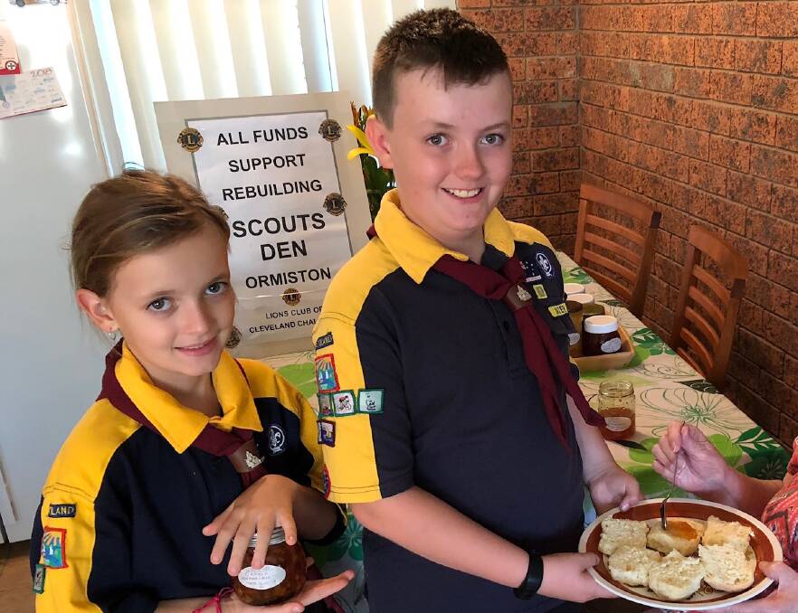 JAM: Cub scouts Mia and Matthew Rosendale sample some home made produce being created for a street stall with Cleveland Challenge Lions to raise funds to support the rebuilding of the Cleveland scount den.