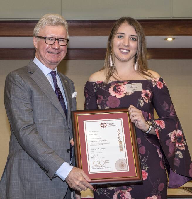 SCHOLARSHIP: Governor of Queensland, His Excellency the Honourable Paul de Jersey presents a scholarship from the Queensland Overseas Foundation to Sarah Nilson of Capalaba.
