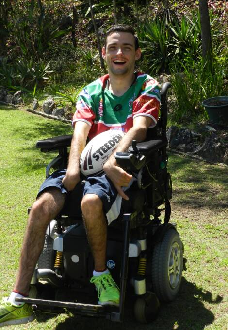 RUGBY LEAGUE: Josh Pople delivers the water bottles for the players of the Redland Parrots, showing that having a disability does not stop involvement in a sport that you love.