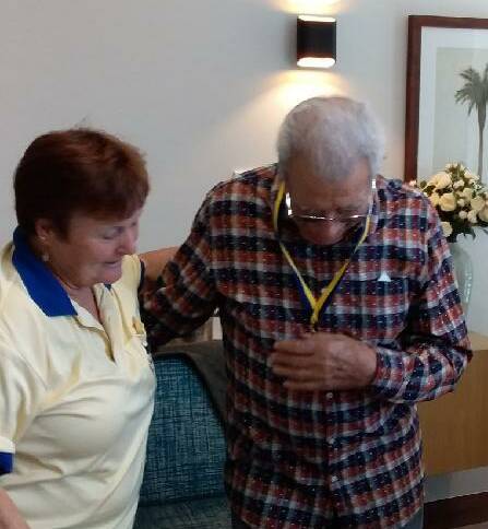 50 YEARS: Jack Rosa receives his 50 year medal for service to Lions Club at Capalaba from President Janet Bastin.