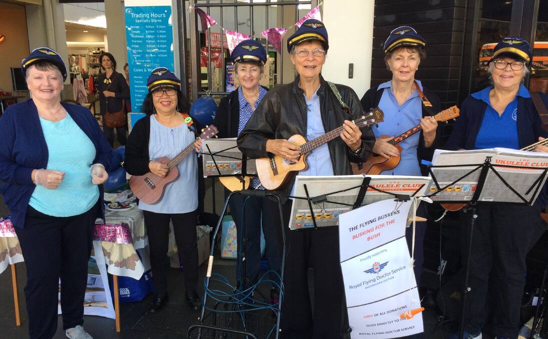 FLYING: Jane Milward (third right) is flying high after raising funds for the Royal Flying Doctor Service with fellow ukulele players on the service's 90th birthday. She busks to raise funds when she travels out west.
