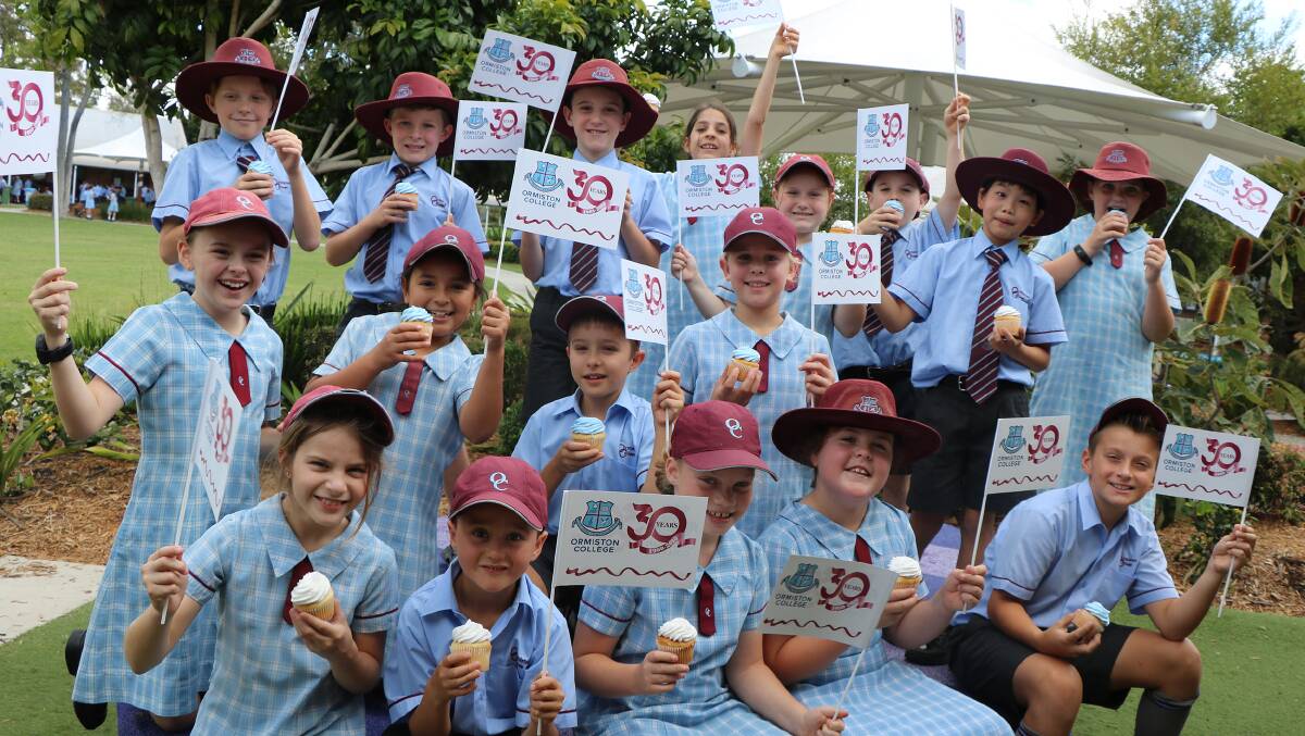 30: Students at Ormiston College celebrate 30 years with a flag and a cupcake and activities on the school oval on October 22.