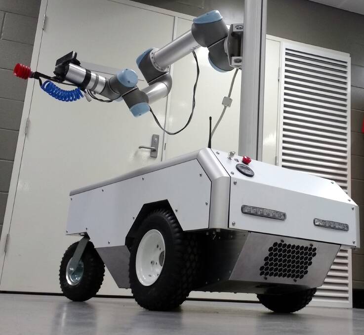 ROBOT: Harvey the robotic harvester has been on trial at the Redland Research station as part of a QUT project spanning two years.