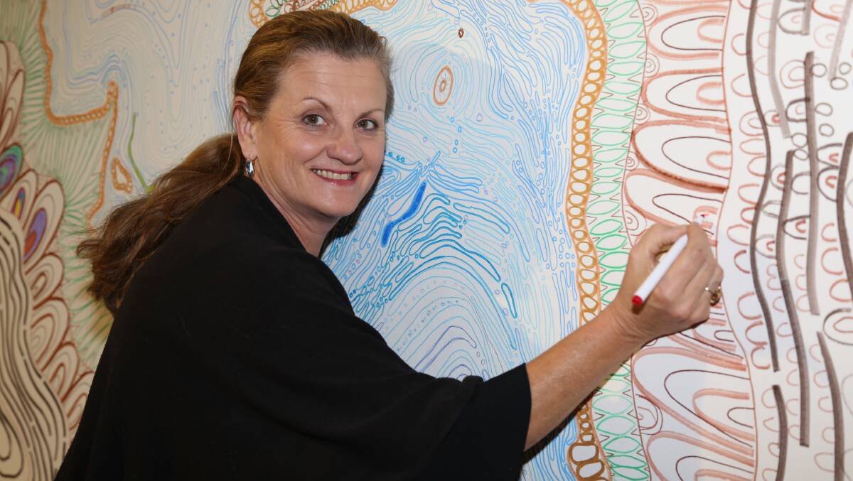 REDLANDS: Mayor Karen Williams at the #luvRedlands exhibition colouring wall, created by Deleven Cockatoo-Collins.