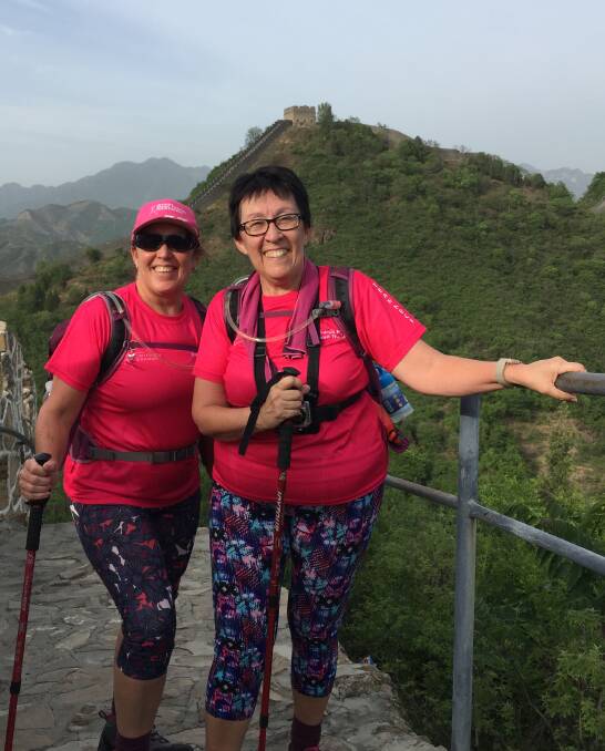WALL: Sisters Kim Miles and Julie Tagg walk the Great Wall of China as part of a fund raising effort for cancer research.