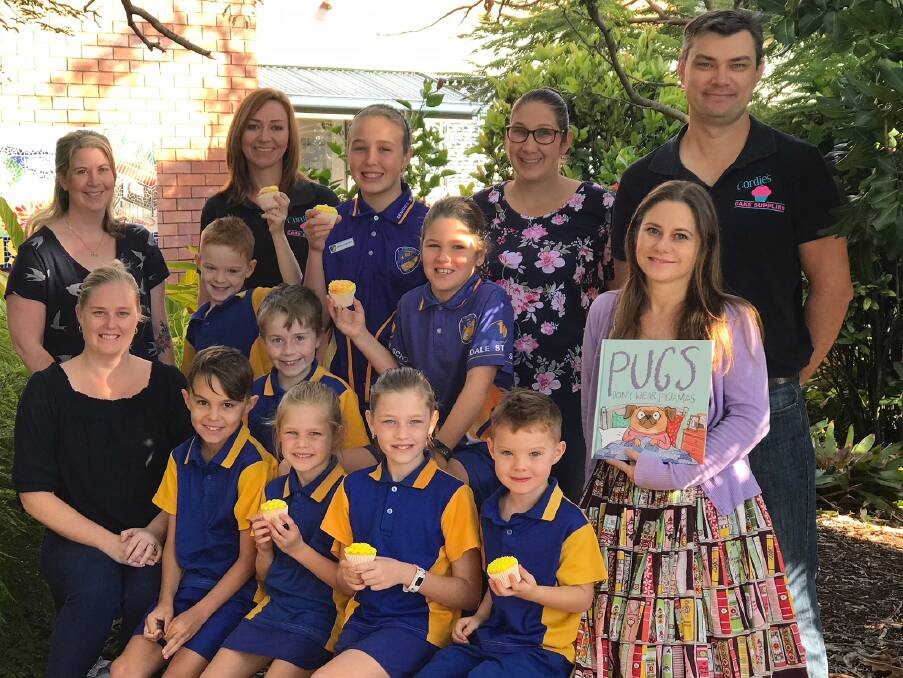 MARKET: Uniting a community are Kirsty Caldwell (Cordies Cake Supplies), Jess Tibbetts and Tracey Munro (P&C), author Michelle Worthington,Tony Caldwell (Cordies Cake Supplies) and Birkdale students. Photo: Birkdale principal Greg Gosling.