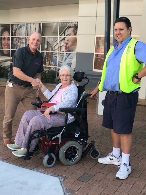ACCESS: Cr Peter Mitchell and STAR driver Rob Fisher, trial the new kerbside ramp outside Cleveland library with Val Hammond who was instrumental in gaining greater access for people with wheel chairs.