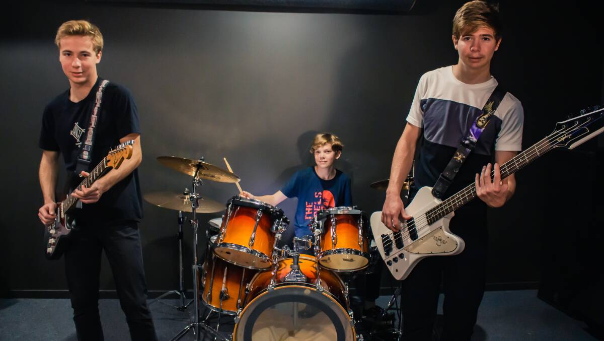 BAND: Scott, Mitch and Curt Luxton of Claim It Anyway have launched a second studio album. Photo: Liam Eugarde