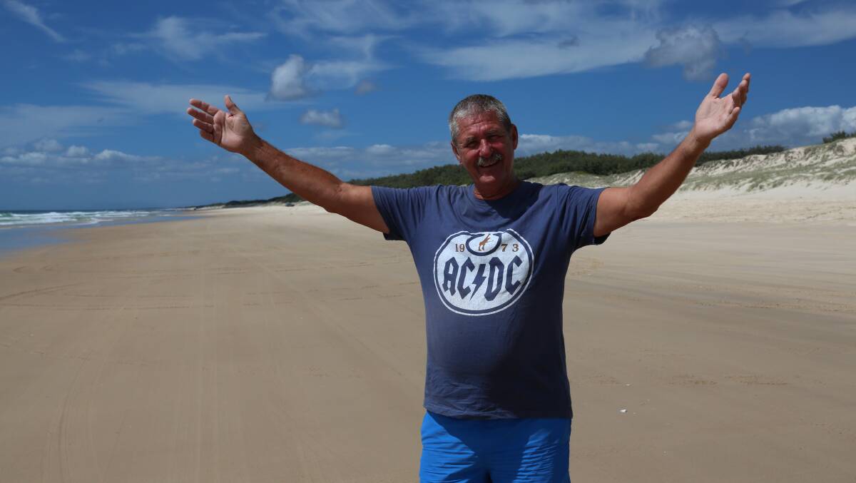 VASTNESS: Dave Thelander, known as Barefoot Dave stands between the most easterly points in Queensland and Australia, pointing out that they are just 32km apart.