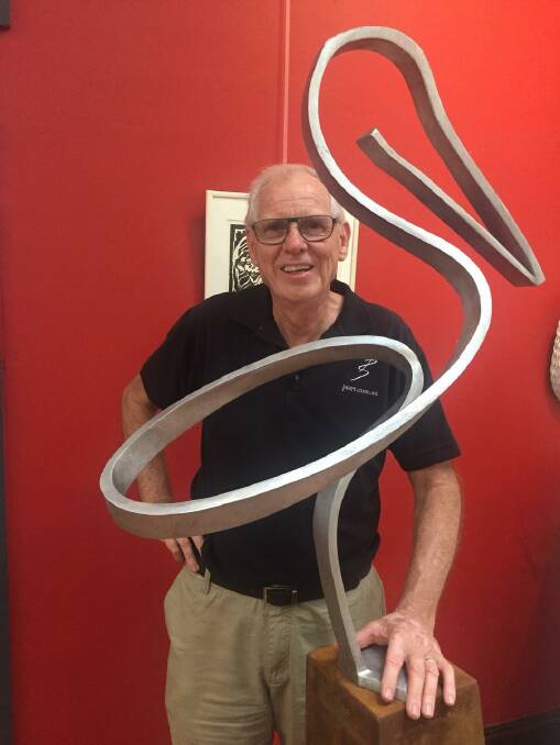 SCULPTURE: Peter Steller with one of his outdoor sculptures to remain on display at Mount Coot-tha Botanical gardens until June 12.