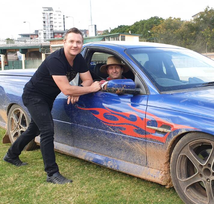 STUNT: Supa Tony Morrison with Gary Baxter and the V8 ute being used in the Ekka stunt show. Morrison is this year's host of Ekka Nights.