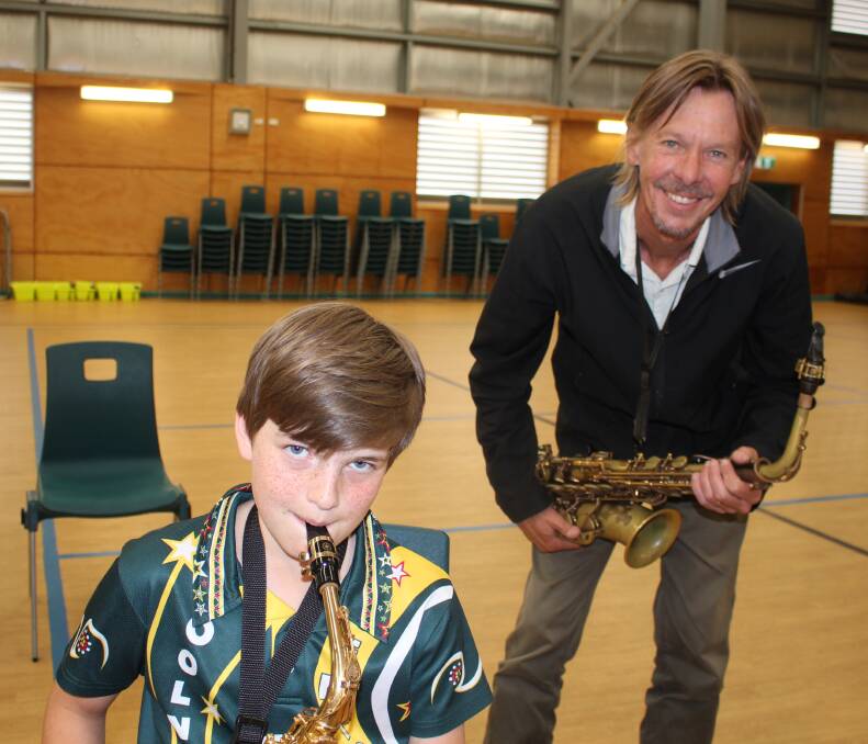 SAXOPHONE: Topologist's John Babbage works with Coolnwynpin's saxophonist James Pinner of Capalaba during a Top Up workshop.