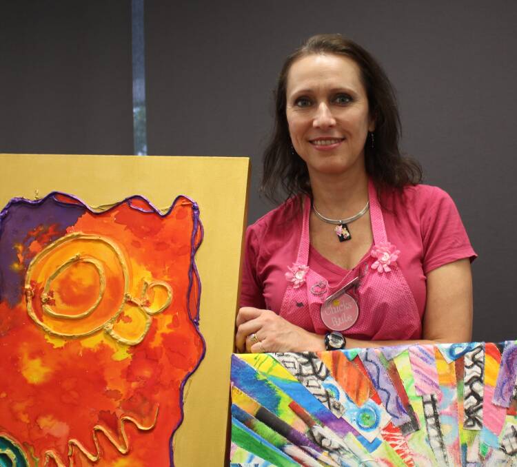 AUCTION: Creative Express Art Therapy group founder Clancy Follett prepares for an art auction on October 13.