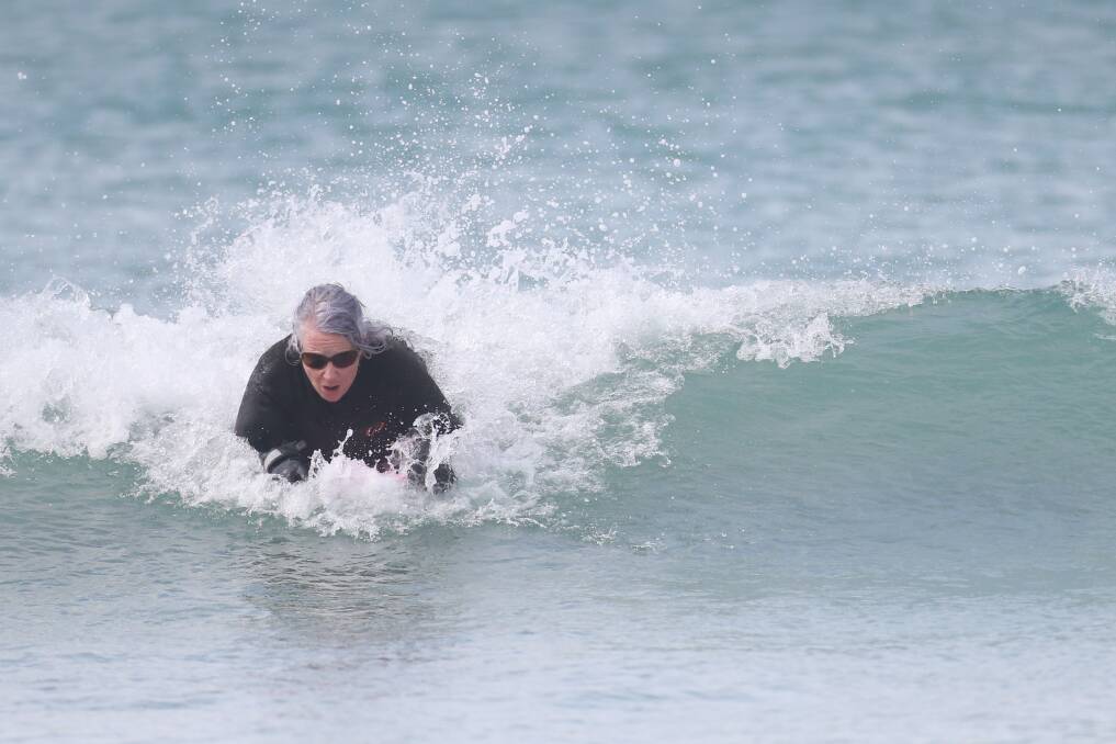 CATCHING A WAVE: Warrnambool's Trish Taylor hits the beach every morning on her bodyboard as part of a growing group of like-minded people. Picture: Mark Witte 