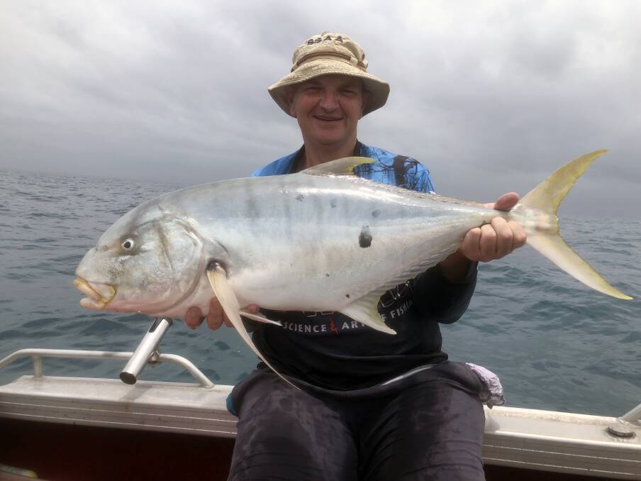 YOU BEAUTY: Len Thorley with a solid trevally that he caught around a shipping beacon off Bribie Island.
