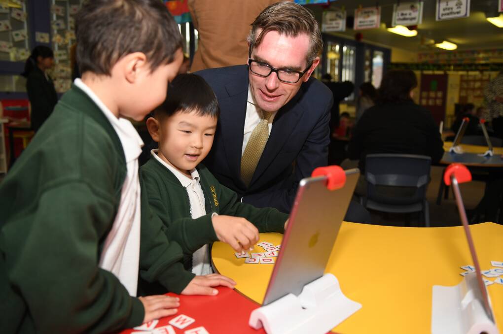 NSW Treasurer Dominic Perrottet meets students at Kent Road Public School in Sydney on Monday. Education will receive an extra $1.2 billion in the upcoming NSW budget, allowing the state government to boast of its record investment in the sector. Picture: AAP Image/Dean Lewins