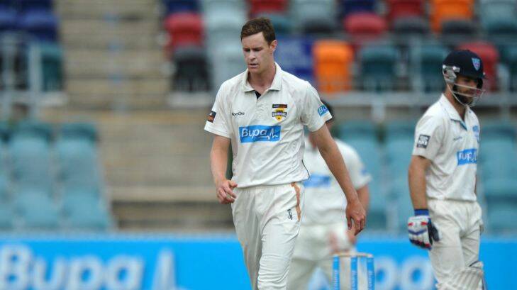 Sport. Sheffield Shield final at Manuka Oval, day one, between NSW and WA. WA bowler, Jason Behrendorff, walks back to his mark before bowling to NSW opener, Ryan carters.  21st. March 2014 Canberra Times photograph by Graham Tidy.