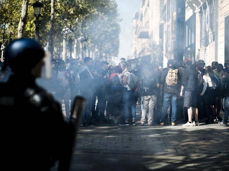 Paris is under high security as a few hundred anti-government protesters began marching