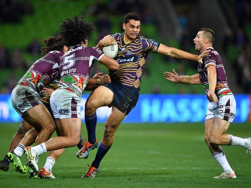 Xavier Coates takes on three Manly opponents during Melbourne Storm's 28-8 victory.