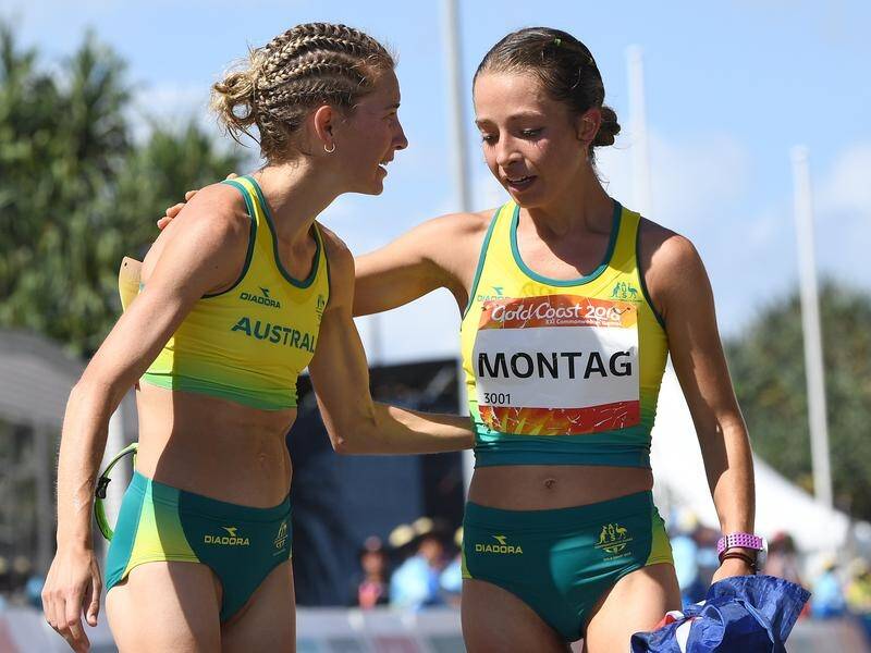 Claire Tallent (l) shares a moment with Jemima Montag after the 20km walk at the Commonwealth Games.