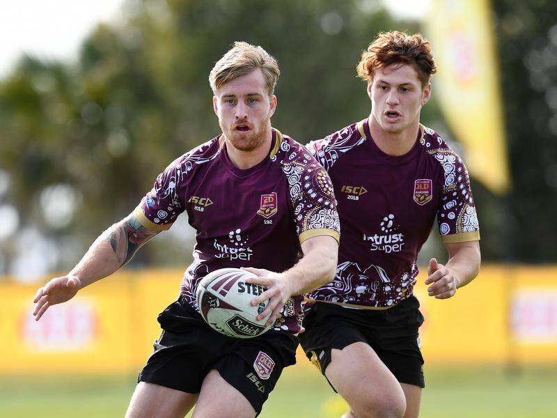 ON THE BOIL: Cameron Munster (left) says Kalyn Ponga (right) can expect to see plenty of ball in Origin I.